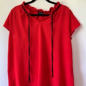 Red blouse with black tie